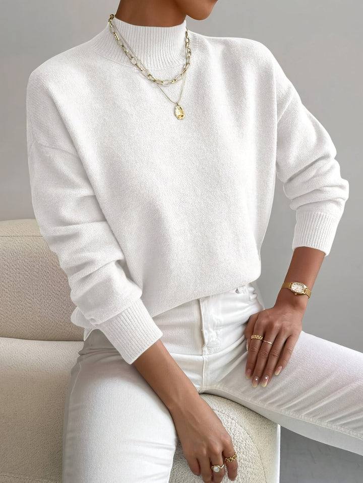 Fashionable black knitted jumper, offering warmth and style this season