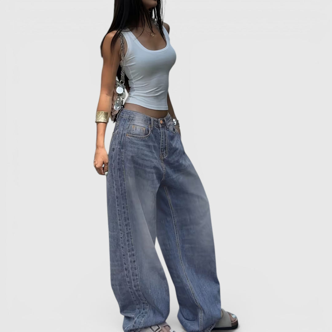 Baggy women's denim jeans, oversized and straight leg, offering a modern casual look.