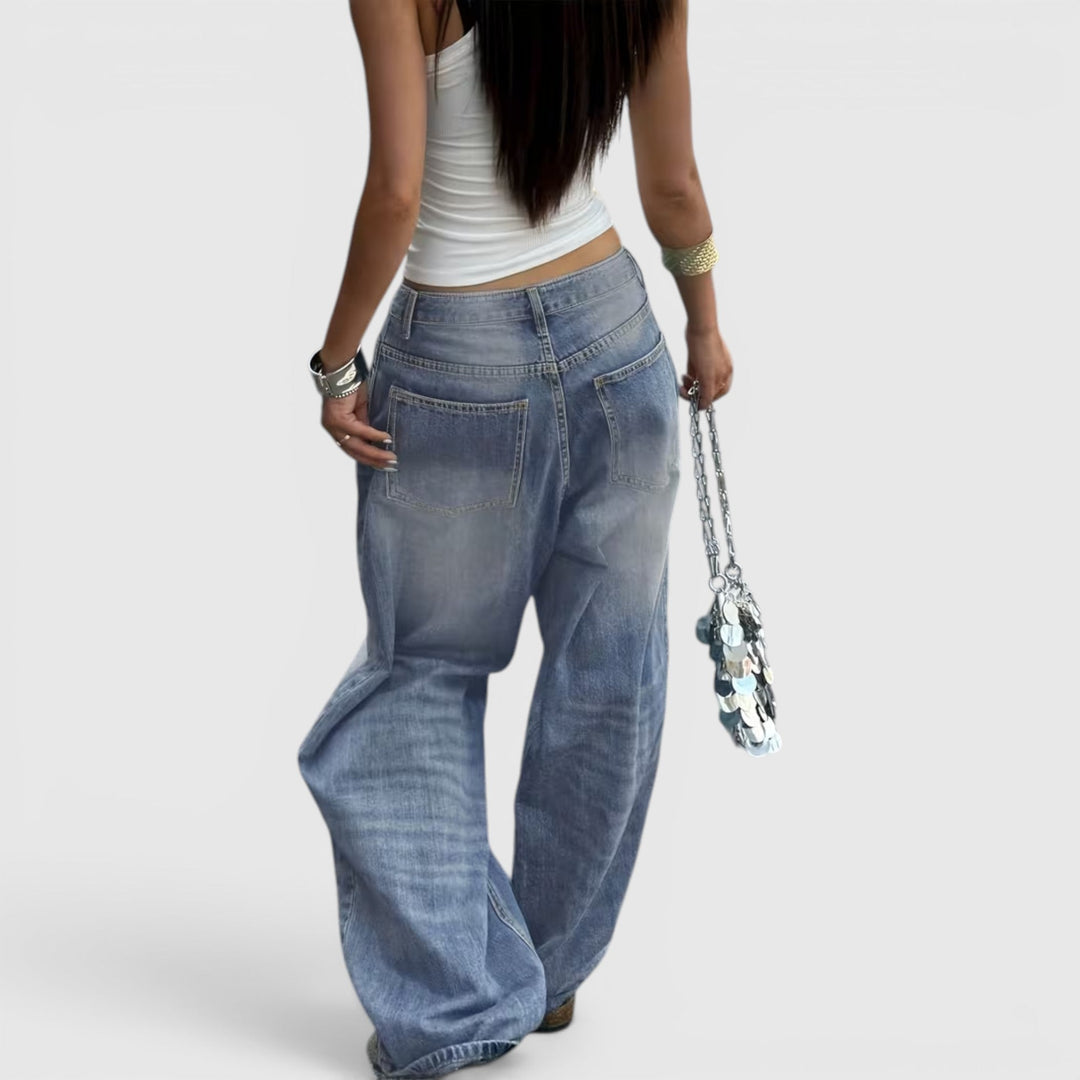 Relaxed fit floor-length women's jeans, high-rise baggy denim for laid-back appeal.