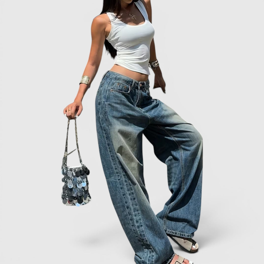 Floor-length straight leg jeans for women, high-rise and baggy, offering relaxed comfort.