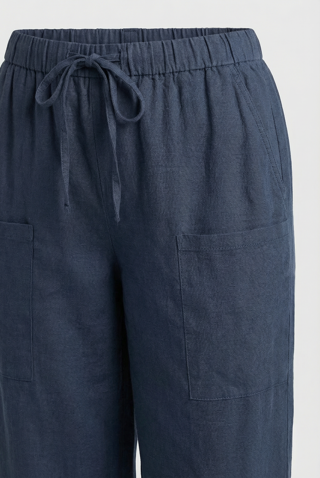 Model wearing high waist cotton pants, showcasing their versatile casual style.