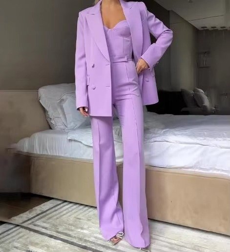 High-waist flared trousers, part of a women's coordinated blazer set, offering a polished and modern look.