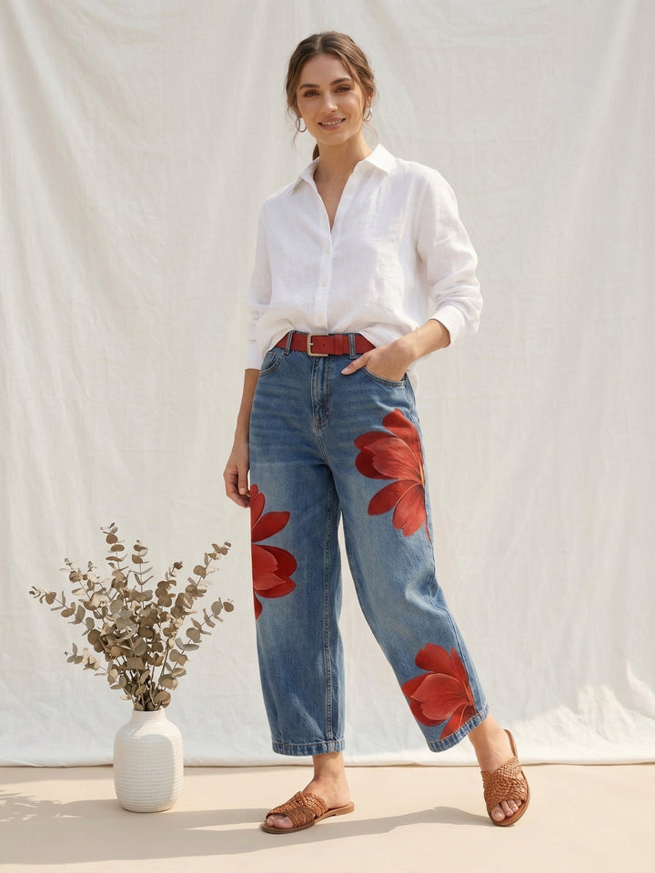 Relaxed fit women's high-waisted trousers with a vibrant floral pattern and straight leg design.