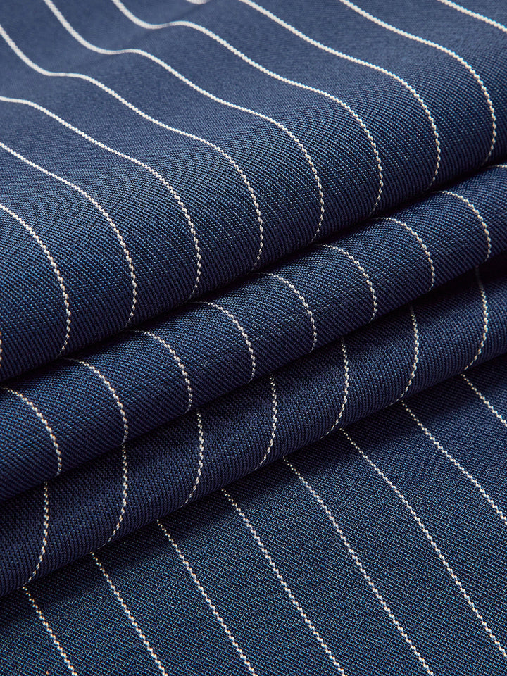 Close-up of elegant women's pinstripe wide leg trousers fabric, highlighting texture and chic design.