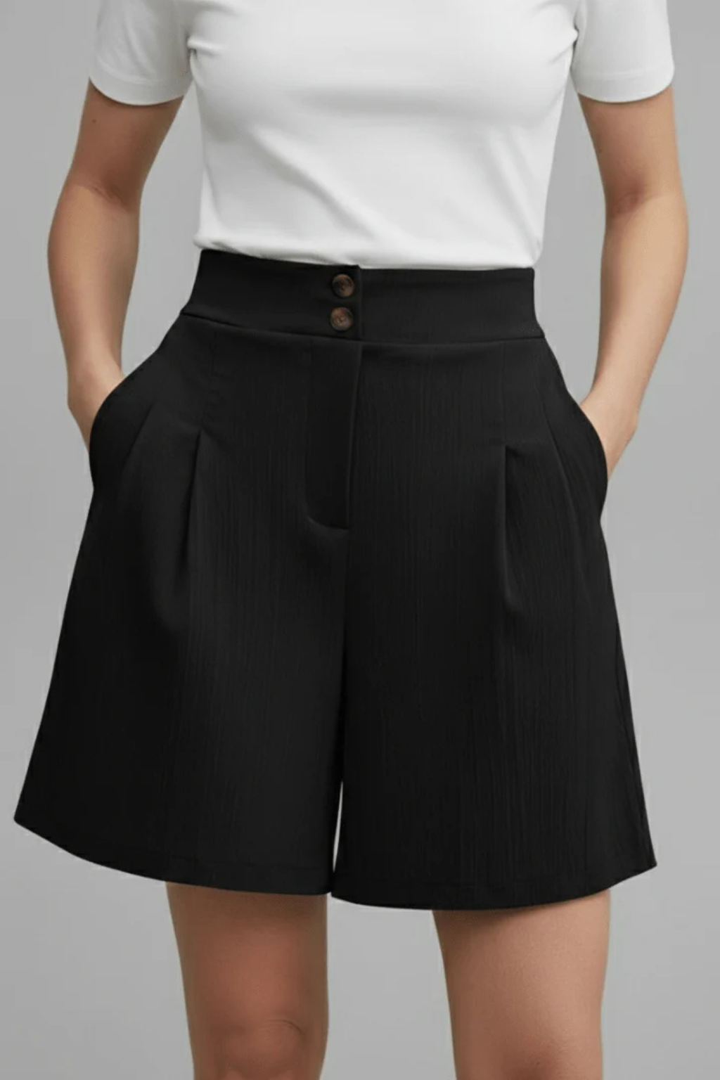 Back view of women's high waist pleated Bermuda shorts, showcasing a flattering tailored summer fit.