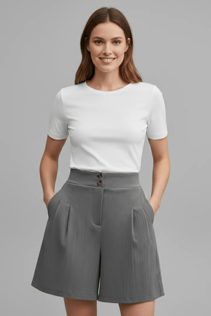 Chic women's high waist Bermuda shorts with elegant pleats, offering a tailored and versatile summer look.