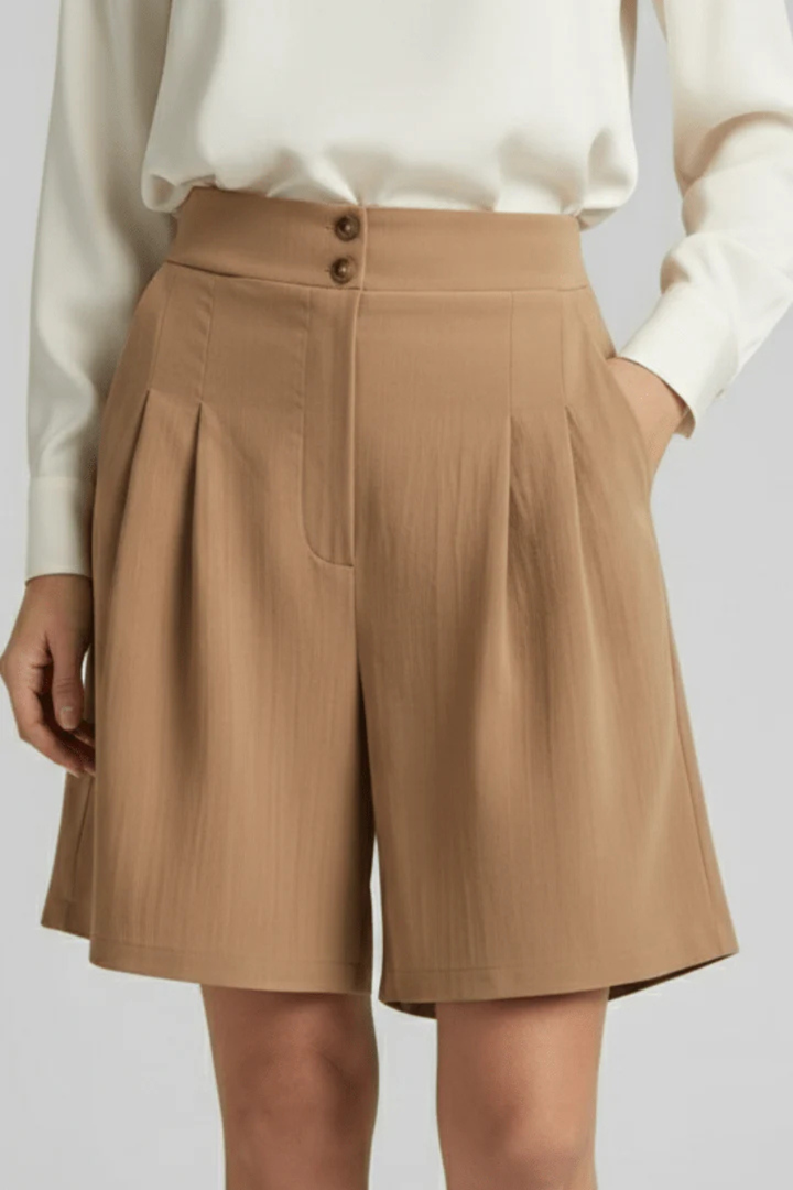 Chic women's high waist pleated Bermuda shorts with tailored wide leg, ideal for casual summer style.