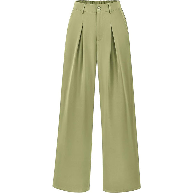 Close-up of high waist and pleats on women's wide leg trousers, showcasing elegant detail.