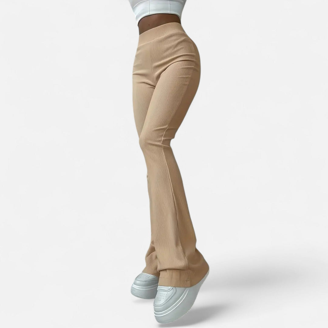 Comfortable women's high-waist ribbed slim leggings, ideal for active or elegant looks.