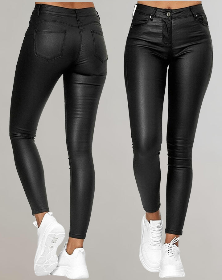 Women's high waist skinny trousers in black, perfect for a sleek, modern look. Versatile for casual or evening wear.