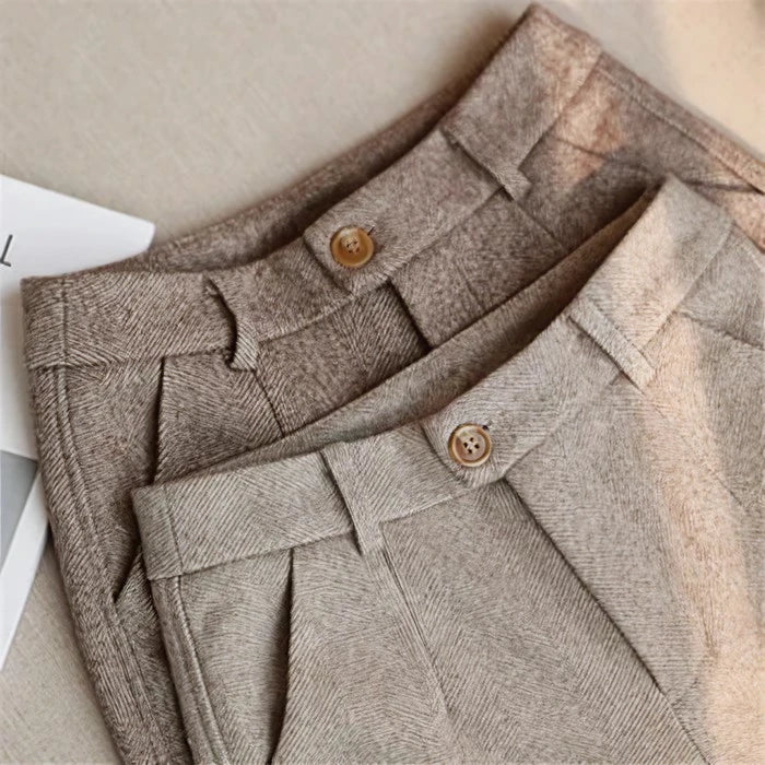 Professional women's slim fit dress pants, high-waist with unique decorative details for business attire.