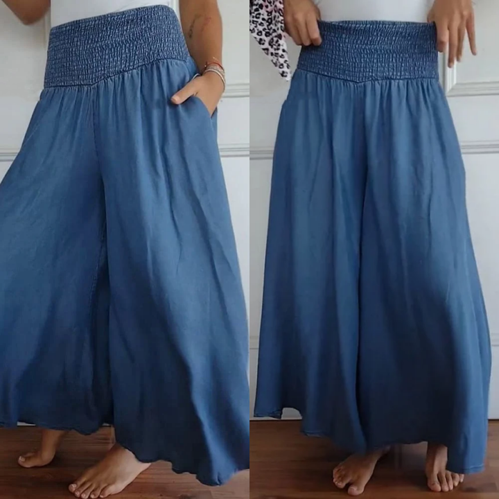 Women's high-waist smocked wide-leg denim trousers for comfortable casual wear.
