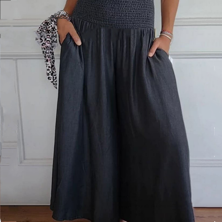 Stylish women's high-waist wide-leg denim pants, smocked detail for elegant casual fashion.