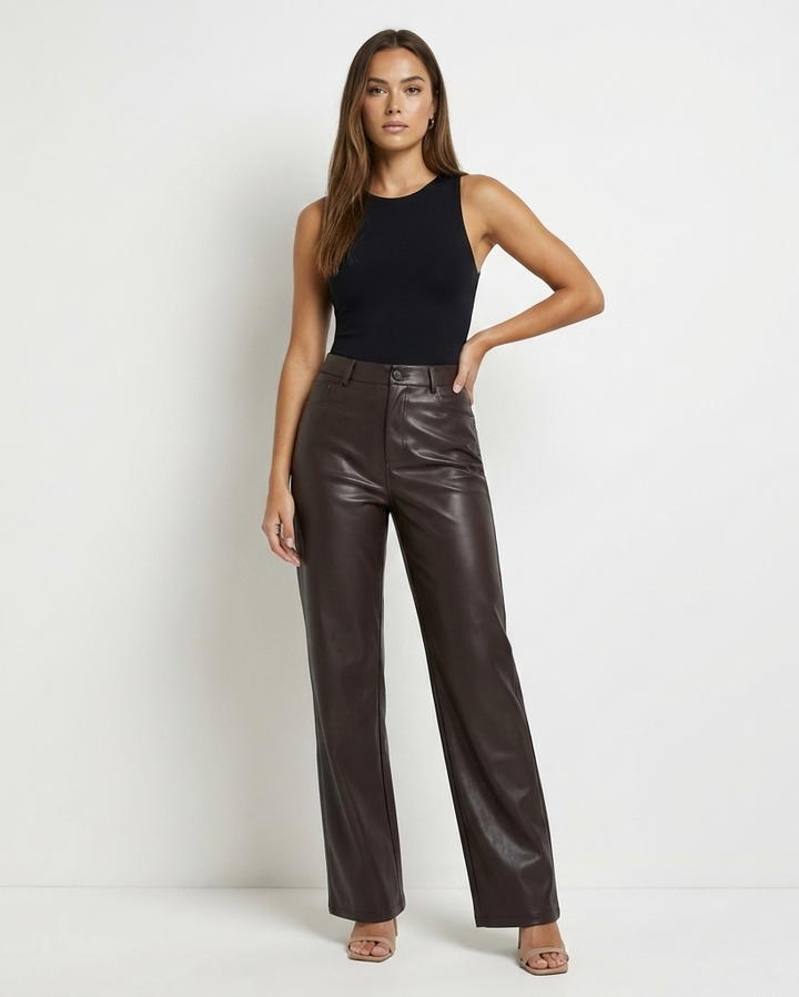 Versatile women's smart trousers in faux leather, suitable for work or casual outfits.
