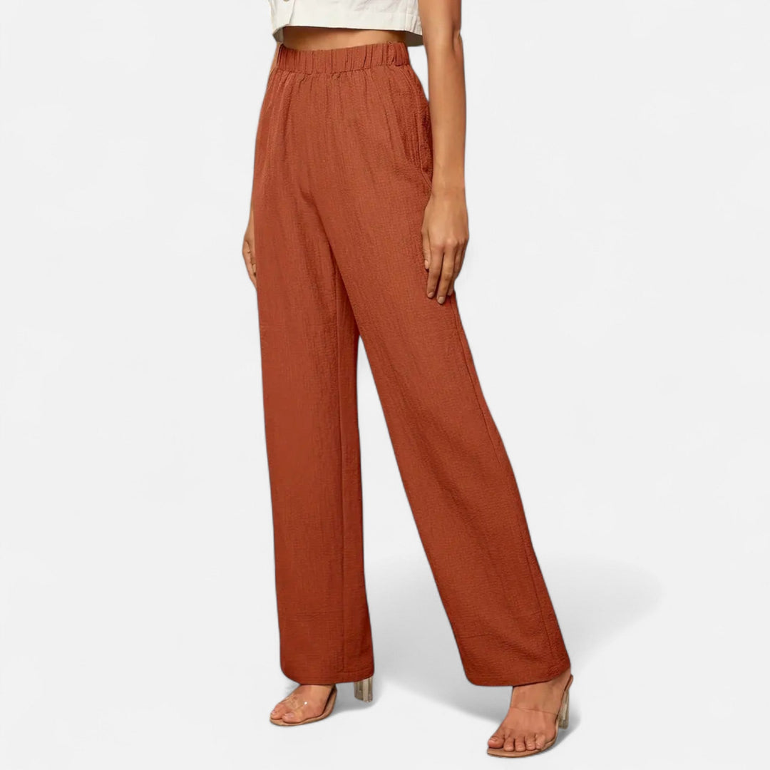 Women's high-waist straight-leg trousers in classic black, perfect for work or casual wear.