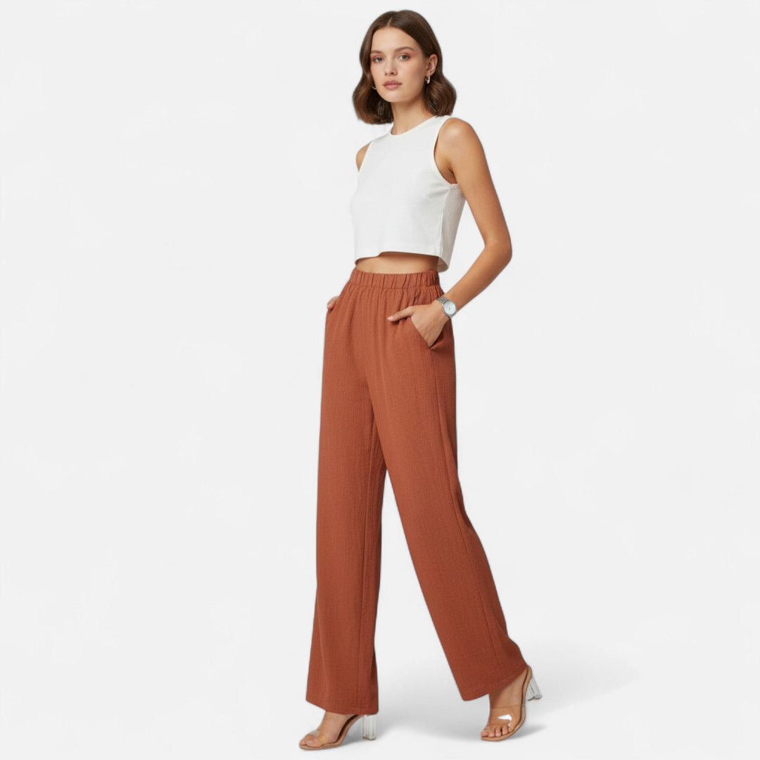 Elegant brown tailored trousers for women, featuring a flattering high-waist and straight-leg cut.