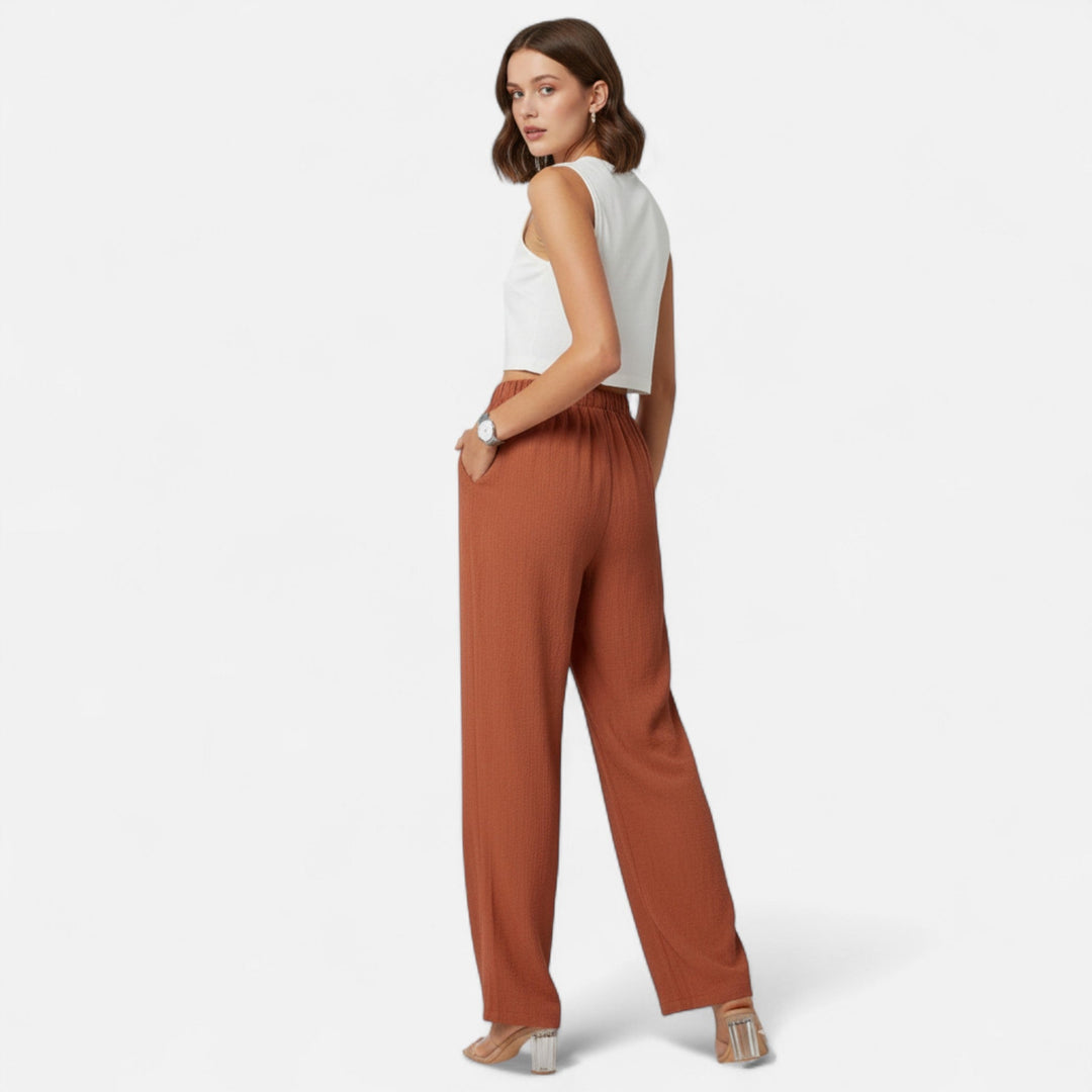 Versatile navy high-waist pants for women, ideal for creating both professional and casual outfits.