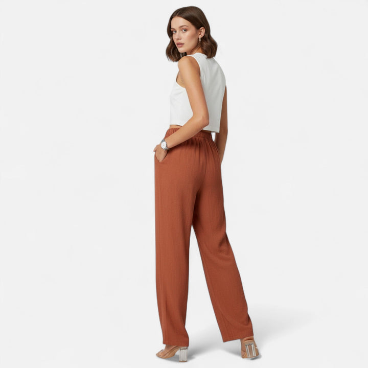 Versatile navy high-waist pants for women, ideal for creating both professional and casual outfits.