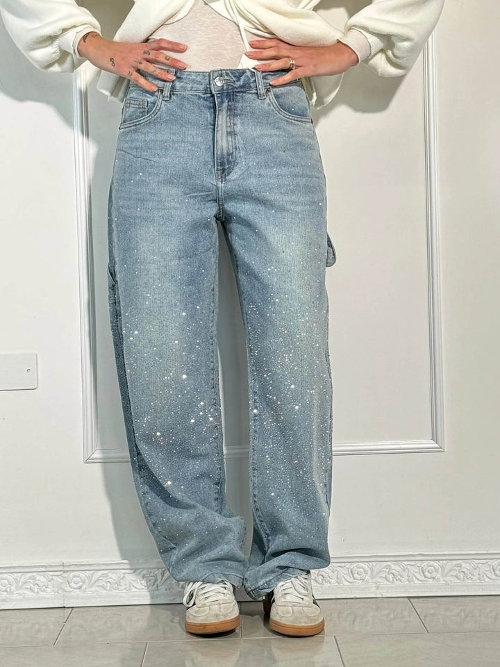 Back view of women's high-waist straight leg vintage denim jeans, highlighting crystal pockets & silhouette.