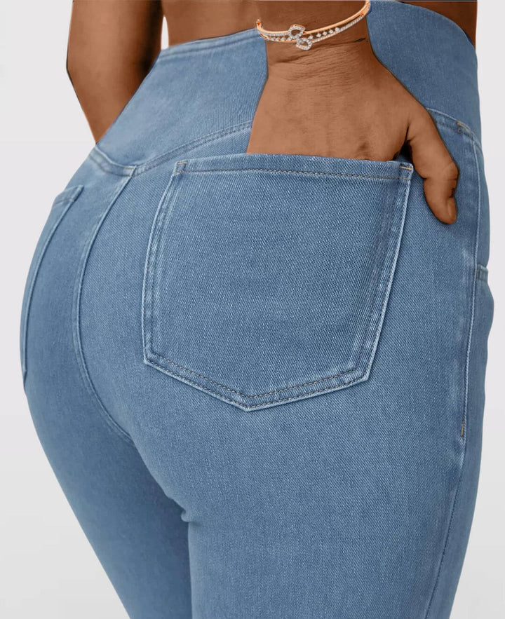 Comfortable dark blue women's high-waist stretch jeans, slim fit for casual elegance.