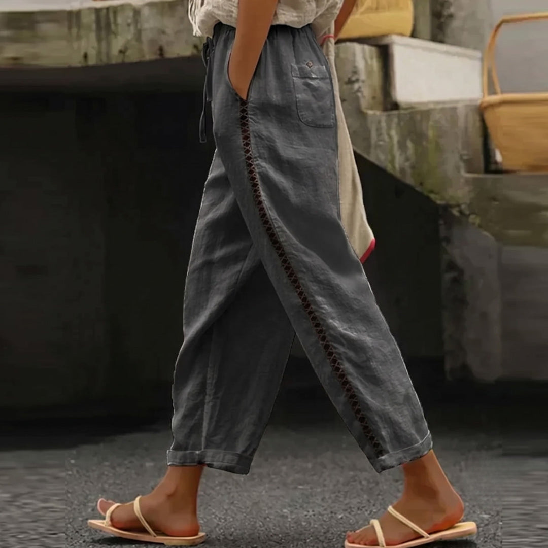 Chic women's high-waist striped pants with tapered leg. Perfect for elegant casual or office summer fashion.