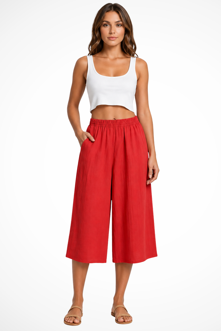 Stylish women's wide leg cropped pants featuring a comfortable high elastic waist and deep pockets.