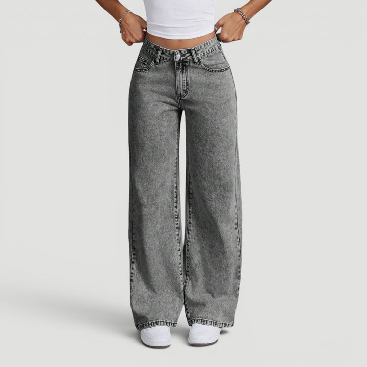 Comfortable women's denim trousers with a high waist and wide leg cut.