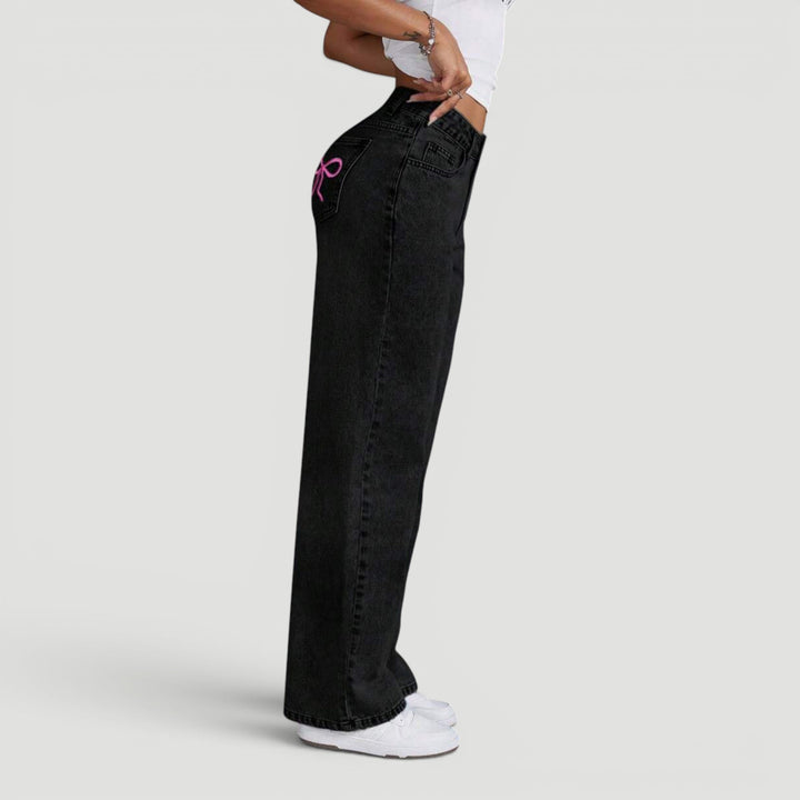 Women's high waist wide leg denim trousers with chic embroidered details.