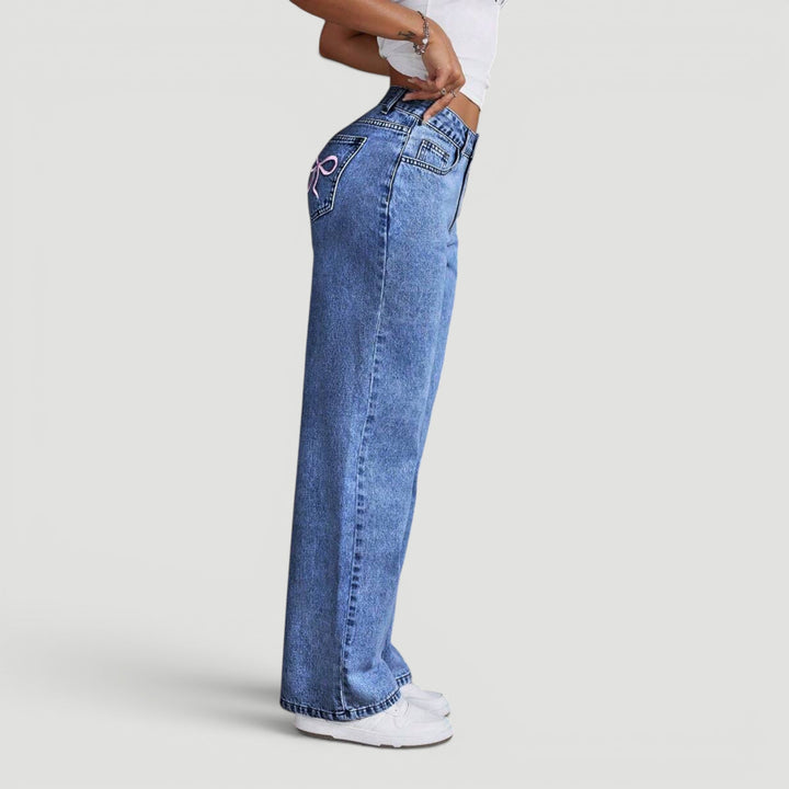 Stylish women's denim trousers, high waist wide leg design for fashion.