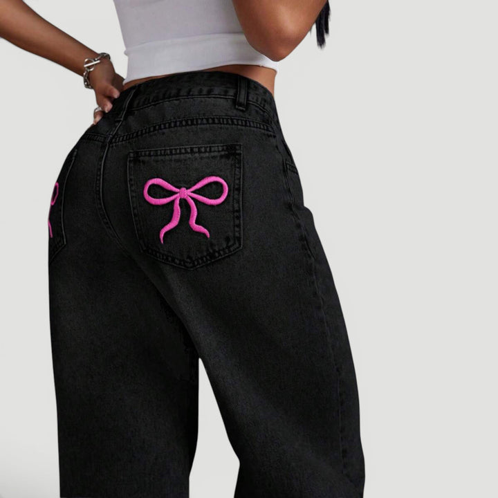 Women's embroidered denim jeans, high waist and wide leg design.