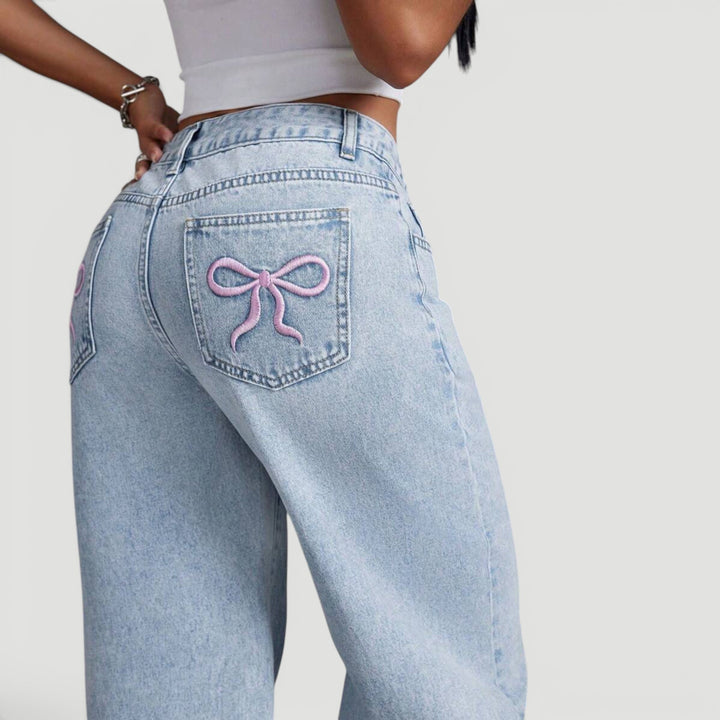 Fashion-forward women's wide leg denim trousers with a high waist fit.