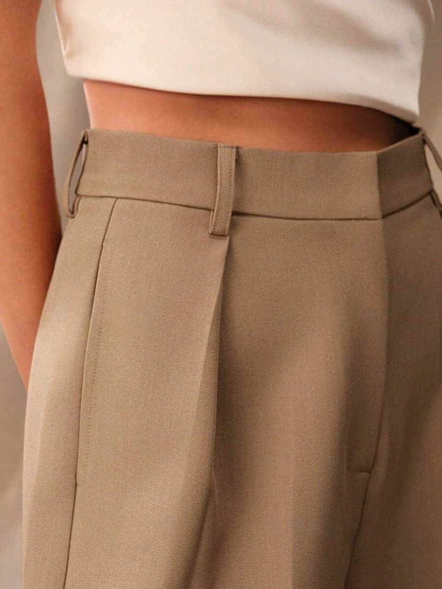 Classic women's high-waist wide-leg trousers, essential for any elegant wardrobe.