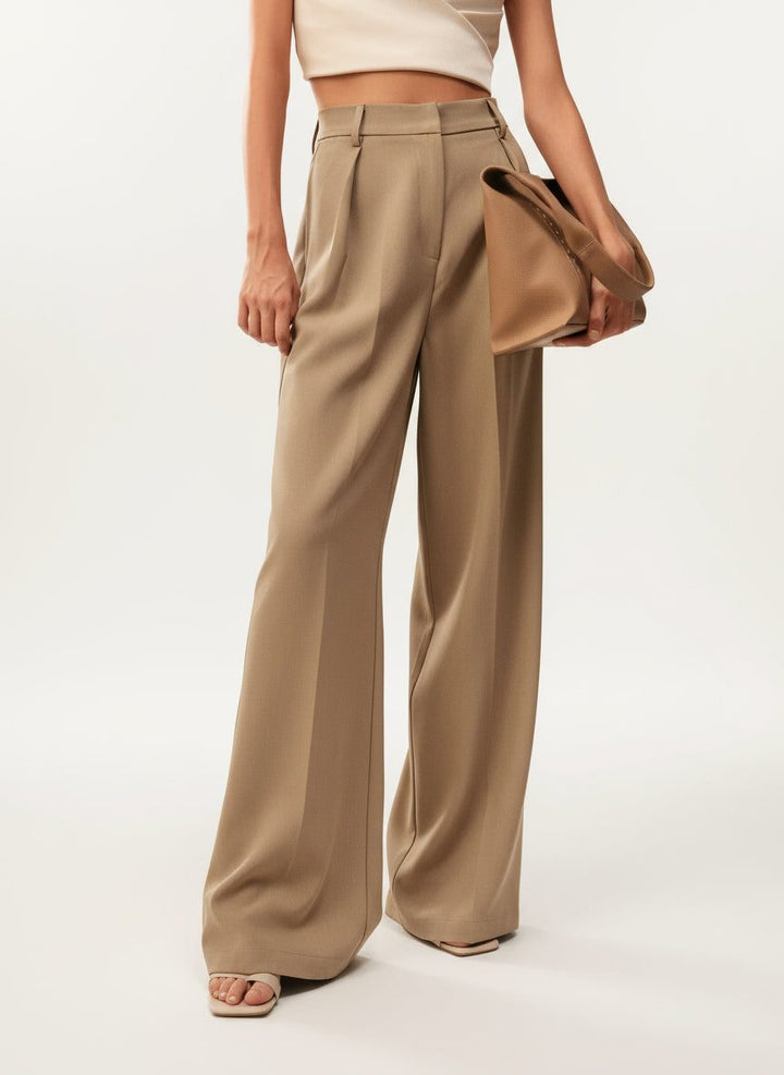 Modern women's wide-leg tailored pants, high-waisted for a sophisticated vibe.