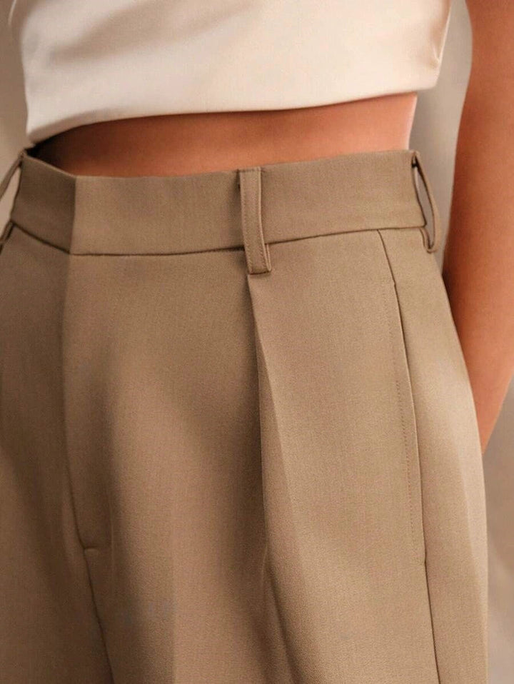 High waist trousers in a crisp white, ideal for business attire.