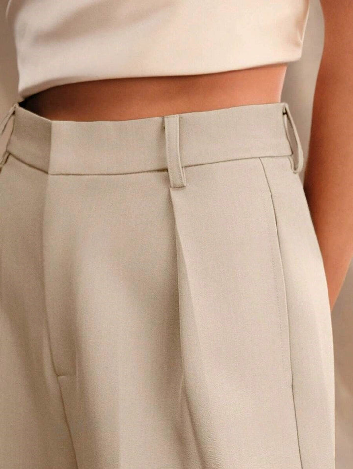 Sophisticated cream wide leg trousers, a must-have versatile fashion piece.