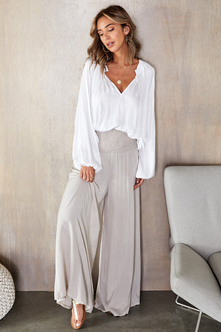 Stylish women's high-waist wide leg pants, comfortable pull-on design.