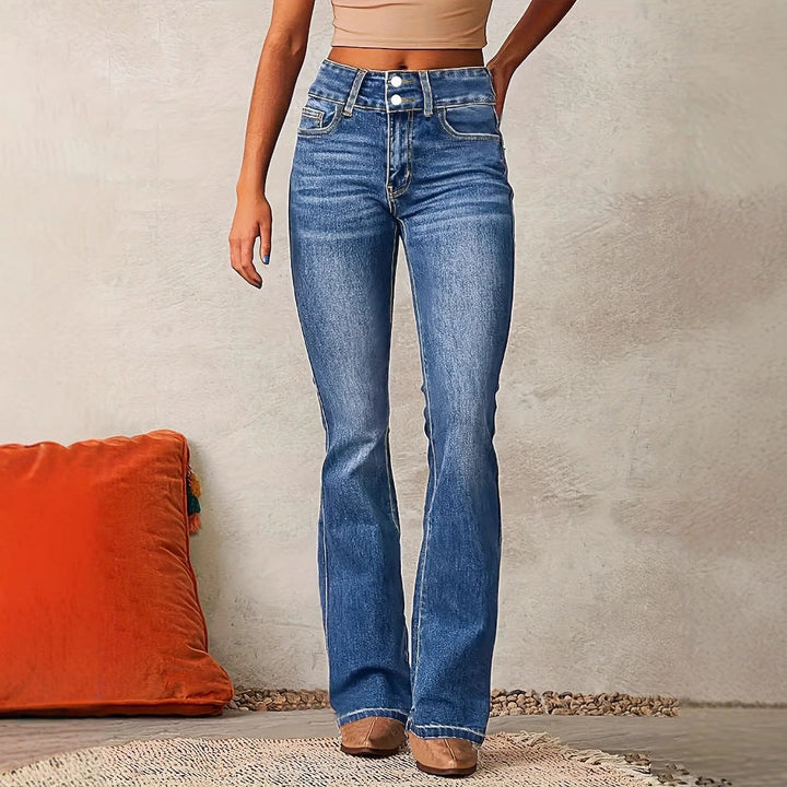 Close-up on the detailed stitching of stylish women's high-waisted denim.