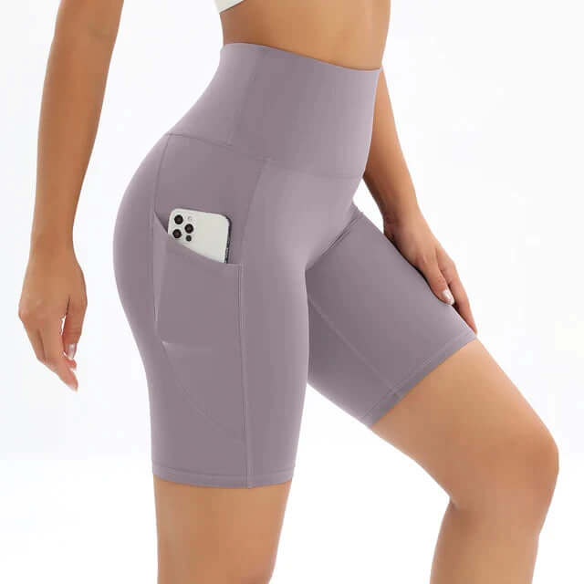 Stylish & comfortable women's gym shorts, high-waisted design with pocket for all activewear needs.