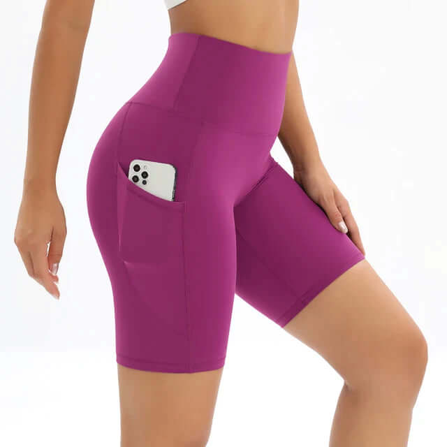 Women's high-waisted activewear shorts with a secure pocket, great for gym, running, & sportswear.