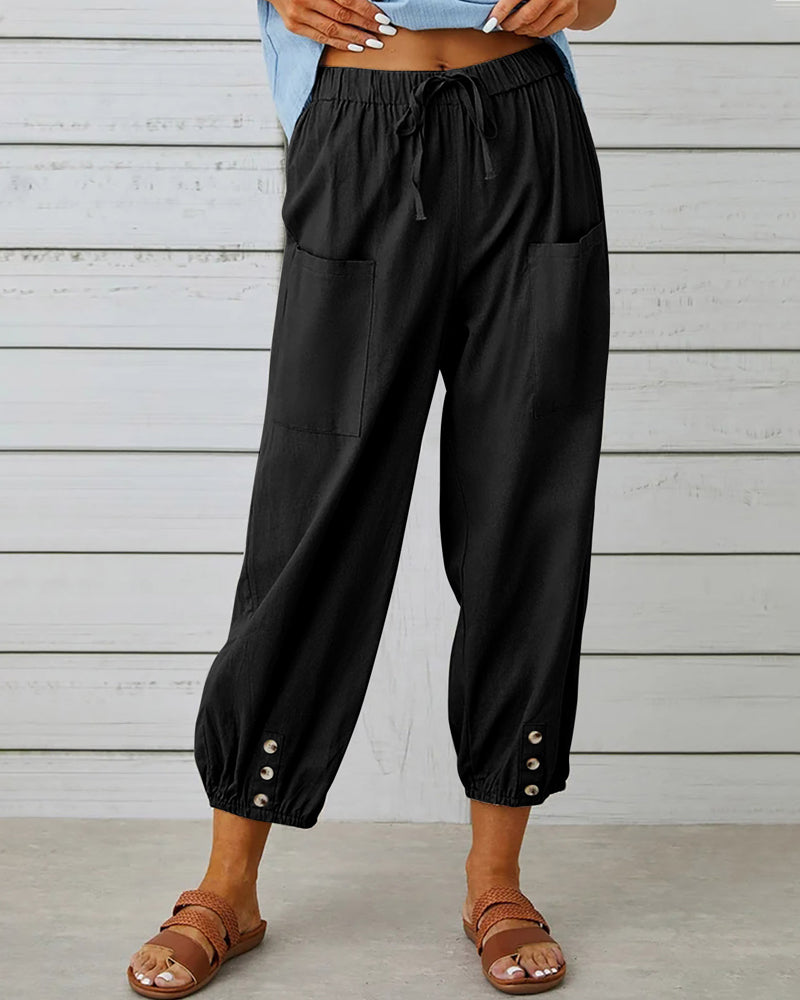 Pair of loose fit casual trousers for women, showcasing breathable fabric