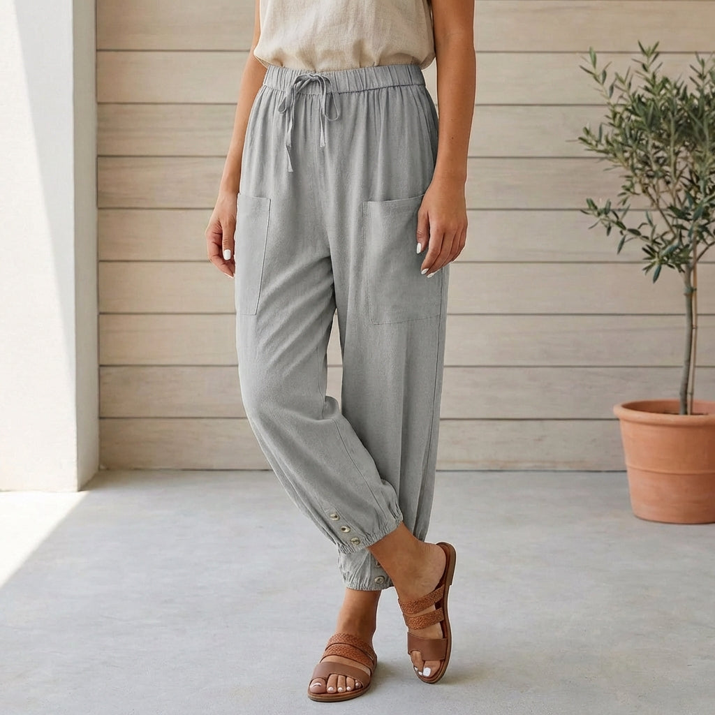 Stylish and comfortable gray cropped pants for women, featuring a relaxed fit and gathered ankles.