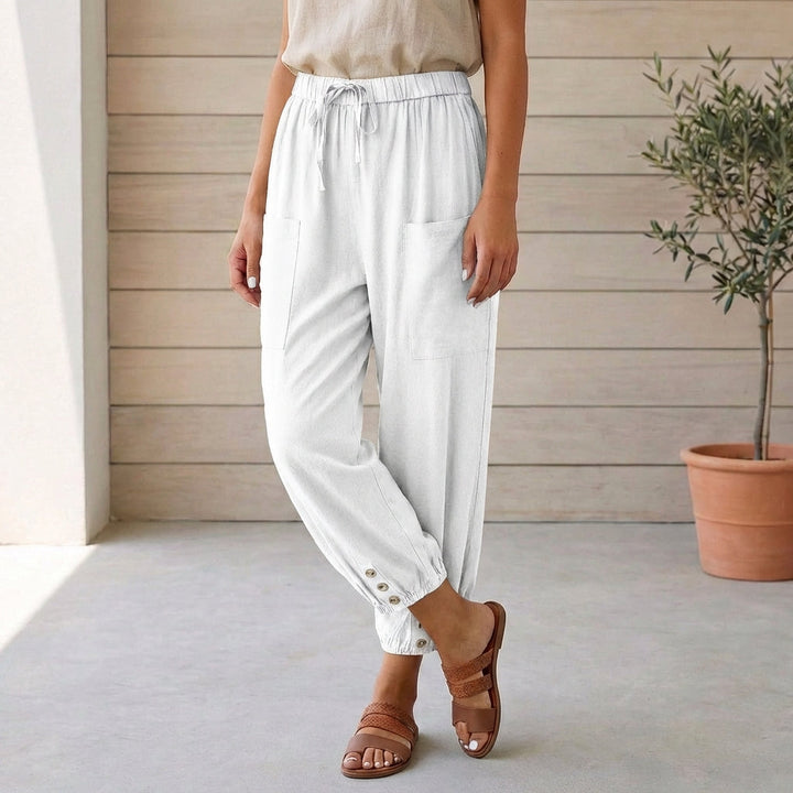 Casual white women's pants with a high waist and relaxed silhouette, finished with gathered ankles.