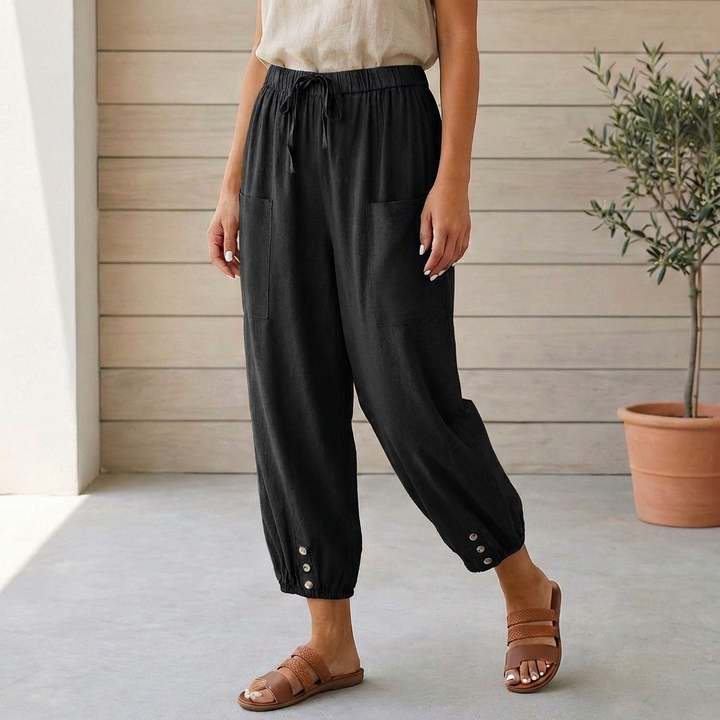 Trendy dark gray high-waisted cropped pants with a relaxed fit and chic gathered ankle detail.