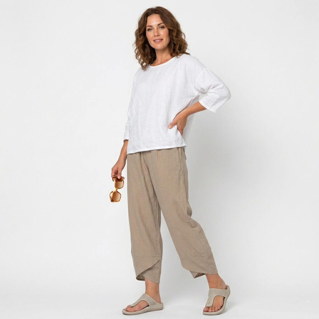 Close-up of the elegant tulip hem on women's high-waisted summer trousers for a chic look.