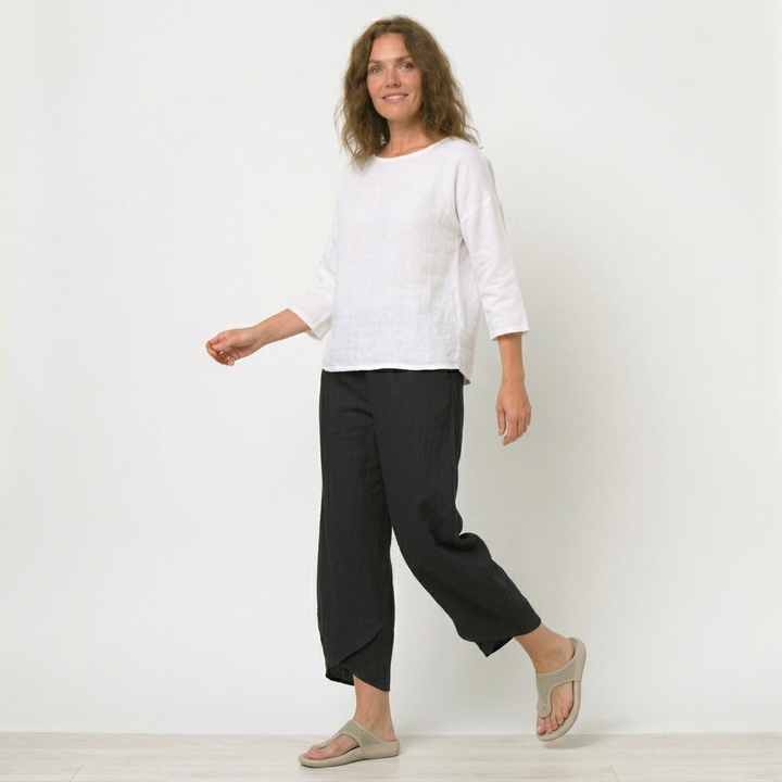Women's high-waisted tulip hem trousers for stylish summer comfort, ideal for travel & holidays.