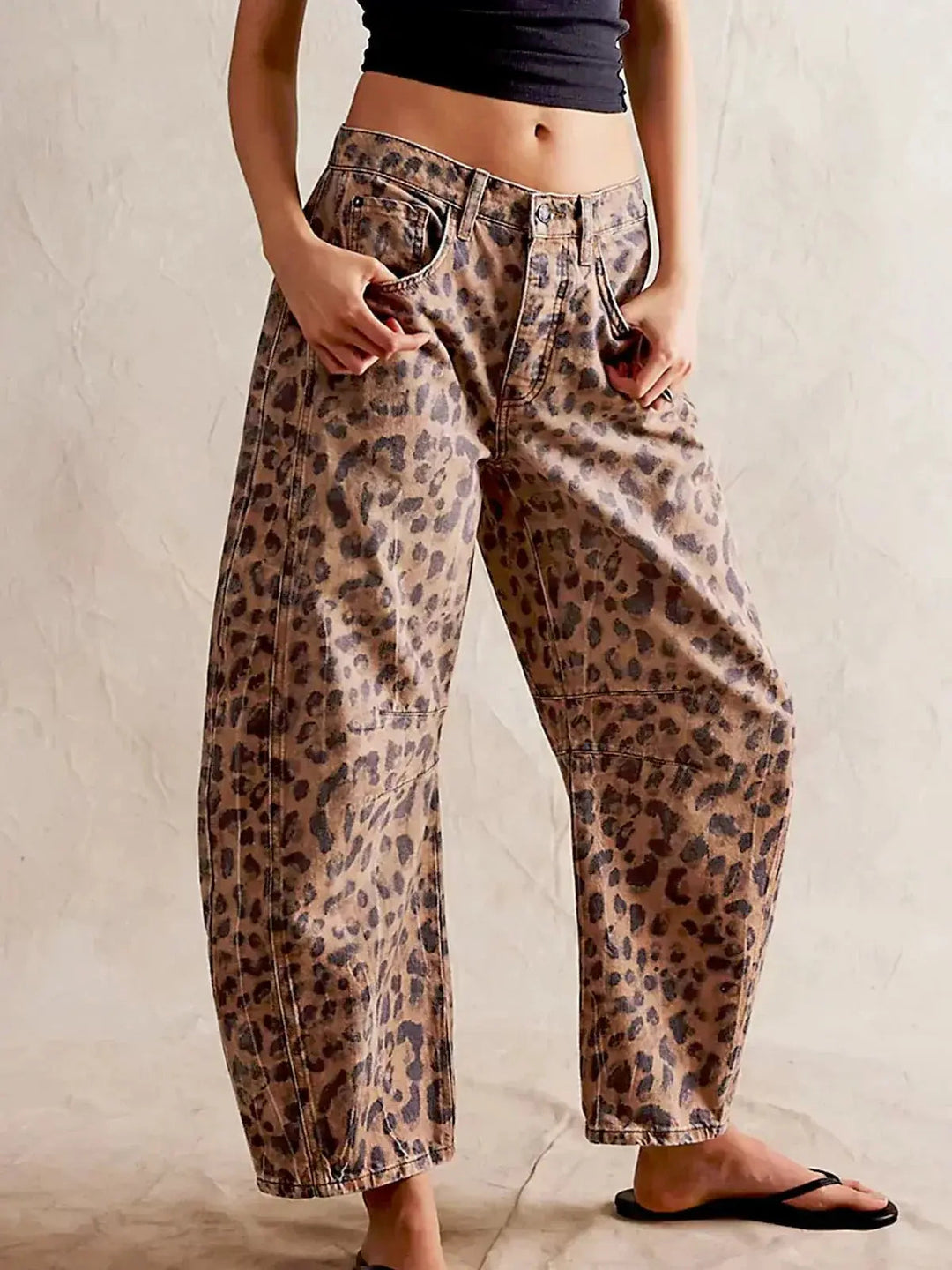 Women's high-waisted wide-leg leopard print jeans, a trendy fashion statement for casual chic style.