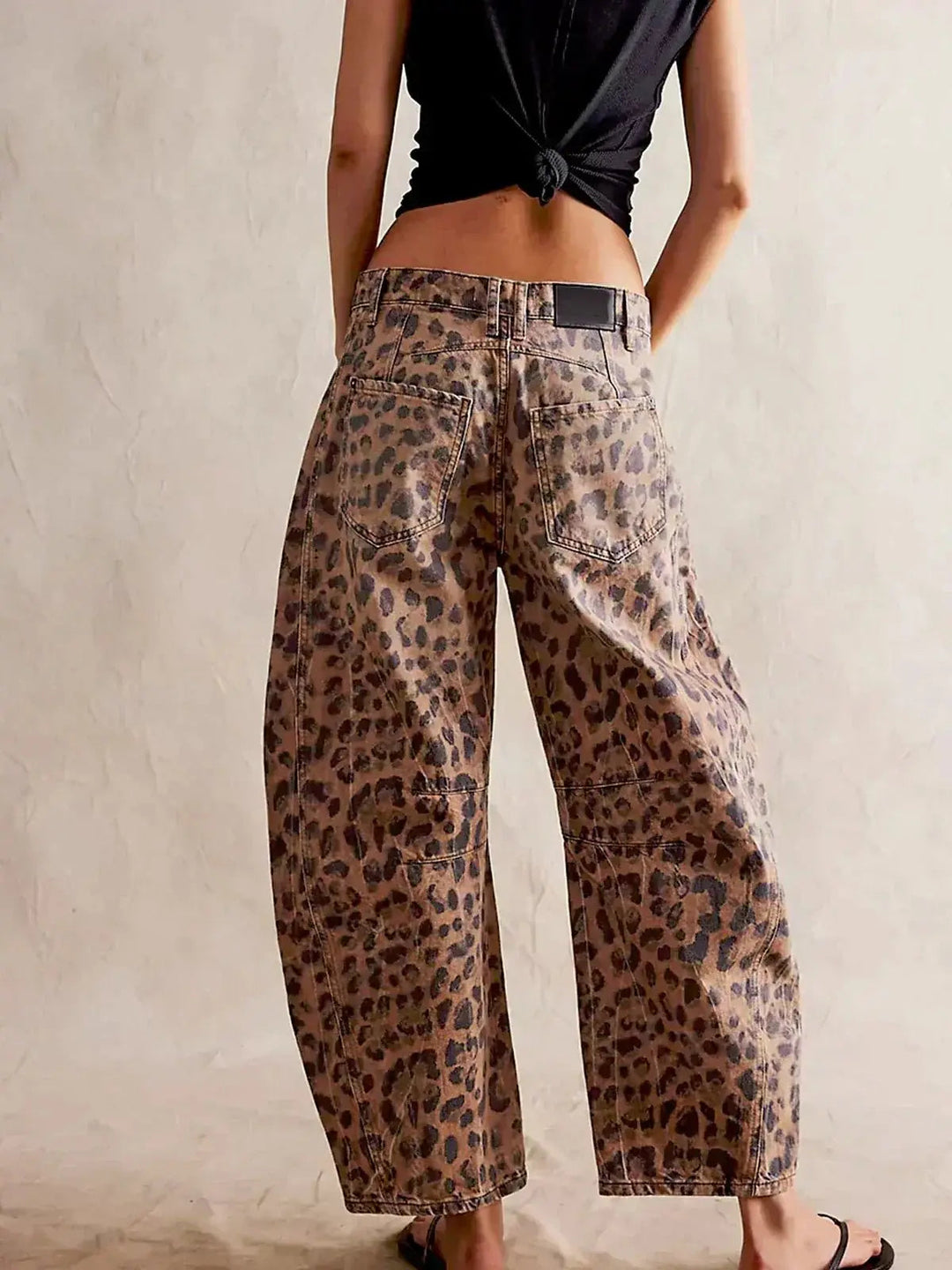 Casual chic women's animal print jeans, high-waisted with a wide leg, for a comfortable and stylish look.