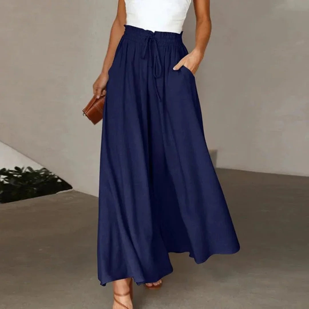 Flowy high-waisted wide leg pants for women, perfect spring/summer style with smocked drawstring comfort.