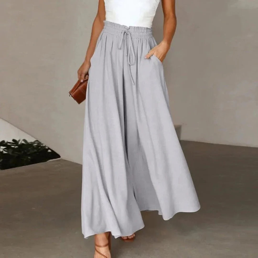 Comfortable women's wide leg pants, high-waisted with smocked drawstring for a relaxed, loose fit.