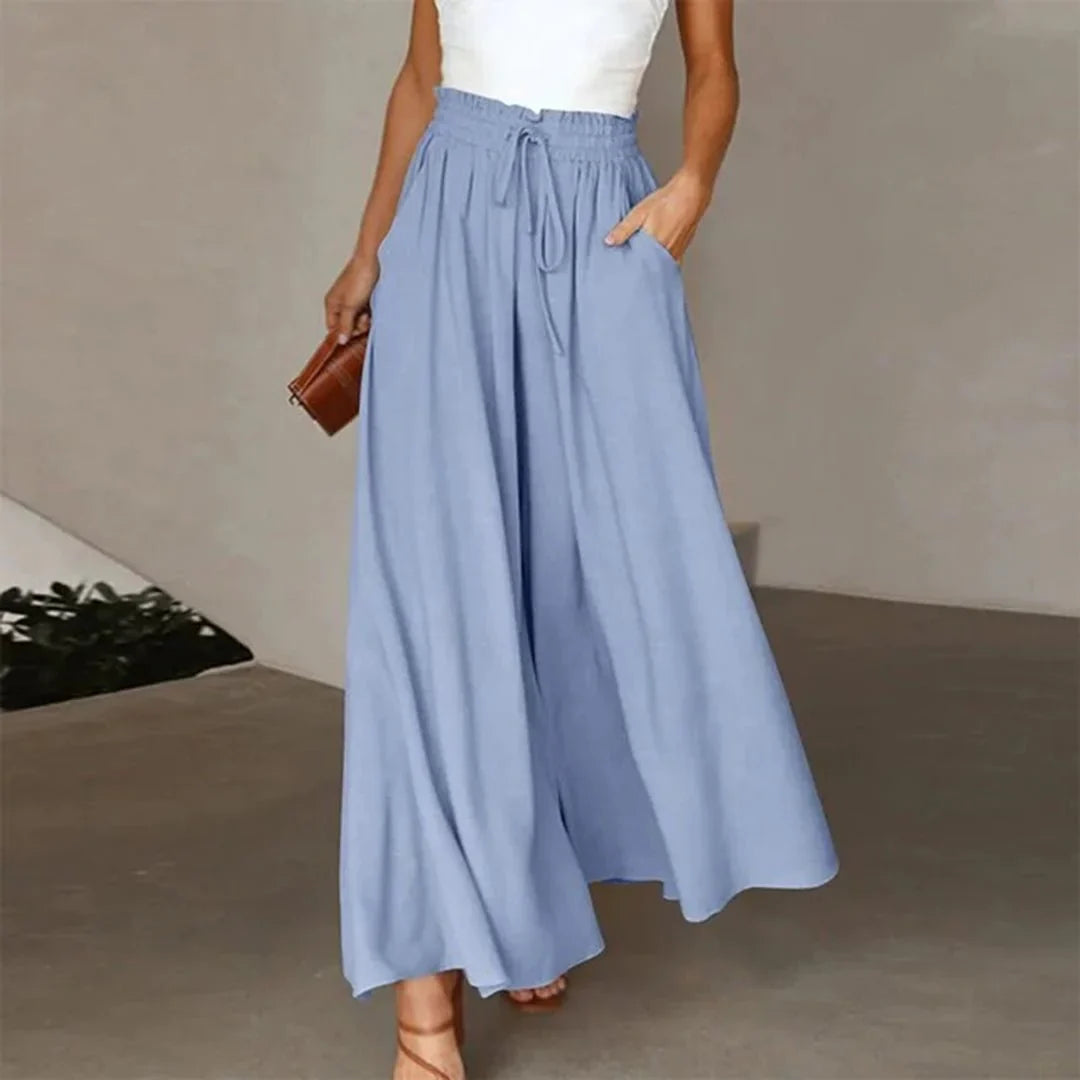 Chic women's high-waisted wide leg trousers, featuring a flattering smocked drawstring waist for a loose fit.